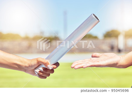 Teamwork, sports and hands of runner with relay race with baton in field stadium event for health, training or fitness. Partnership, goal and support with athlete running in exercise or competition 95045696