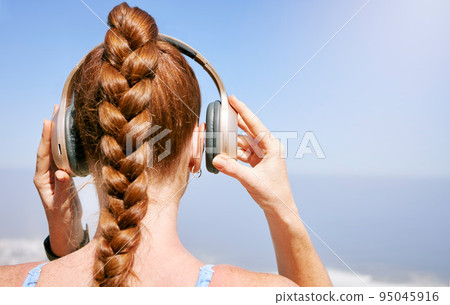 Fitness, nature and woman listening to music during exercise, health and cardio workout with scenic views. Radio, podcast and streaming with rear view of female prepare for zen and relax meditation 95045916