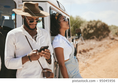 Safari travel, fashion and african couple with car and smartphone for social media update, location check and countryside lifestyle. Influencer black people or youth with summer clothes and transport Safari travel, fashion and african couple with car and smartphone for social media update, location check and countryside lifestyle. Influencer black people or youth with summer clothes and transport 95045956
