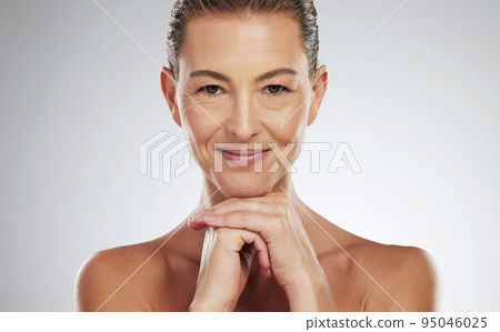 Mature model, face and skincare in wellness, beauty and cosmetics portrait in studio. Woman, skin and smile for anti-aging product for facial, cosmetic and health show happiness in makeup portrait Mature model, face and skincare in wellness, beauty and cosmetics portrait in studio. Woman, skin and smile for anti-aging product for facial, cosmetic and health show happiness in makeup portrait 95046025