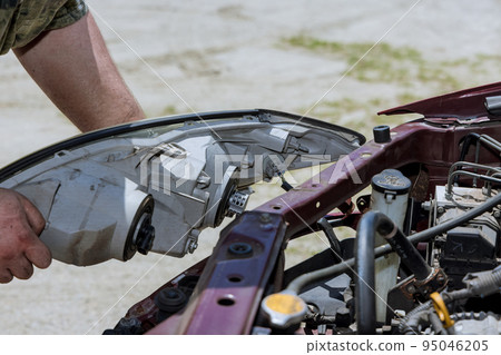After car accident, vehicle will need to have headlight installed as result of damage After car accident, vehicle will need to have headlight installed as result of damage 95046205