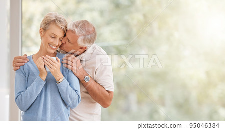 Coffee morning, kiss and senior couple with smile during breakfast in retirement house at window with mockup space. Elderly man and woman with love and hug during holiday in Portugal and drink of tea 95046384