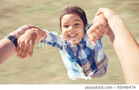 Family, happy and swing with child and arms of parent in garden for fun, smile or love. Health, support and holding hands with son and dad playing outdoors for summer, lifestyle and motion together 95046474