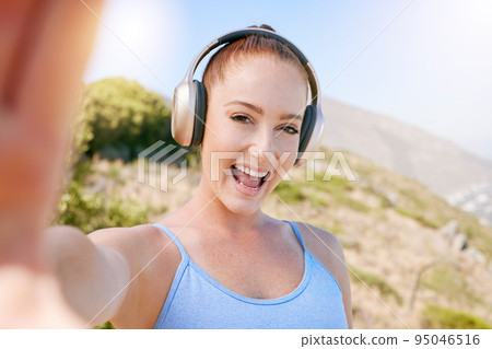 Fitness selfie, happy and smile of woman streaming music on headphones outdoor in nature. Happiness of a person after a wellness, sport and exercise while listening to web radio or internet audio 95046516
