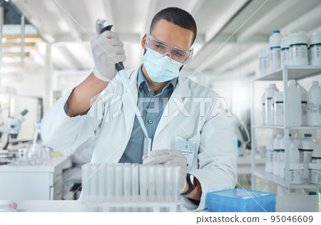 Covid, science and research with man in laboratory with a face mask working on medical, pharmacy and vaccine investigation. Innovation, healthcare and medicine with expert scientist and chemistry 95046609