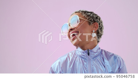 Happy black woman, beauty and fashion sunglasses, retro and cool vintage look. Model, female and unique style, costume or designer jacket outfit and jewelry isolated on pink studio mockup background. 95046758