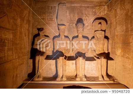 Statues in a shrine inside an Egyptian temple 95048720