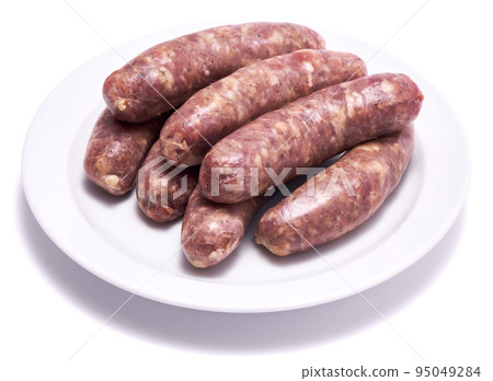 Raw beef or pork grill sausage on ceramic plate isolated on white background Raw beef or pork grill sausage on ceramic plate isolated on white background 95049284