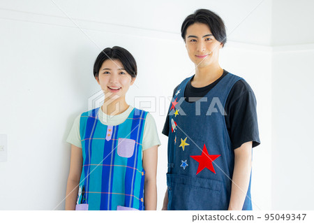 Nursery teacher image: male and female 95049347