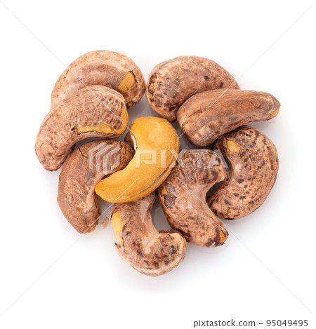 Roasted cashew nuts isolated on a white background. 95049495
