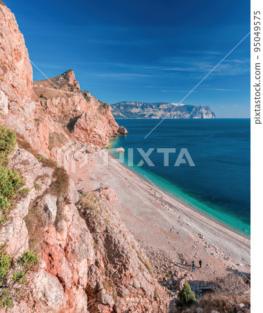 Beautiful Vasili beach in Balaklava, Sevastopol, Crimea. View from the top of the rock. azure sea, sunny day clear sky background. Copy space. The concept of calmness, silence and unity with nature 95049575