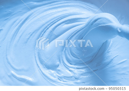 Mixing building mix. Putty for walls. Beautiful slow motion, the texture of the putty is clearly visible. Blue 95050315