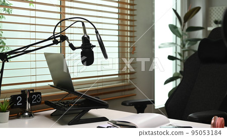 Home studio podcast with professional condenser microphone, laptop and headphone. Technology and audio equipment concept 95053184