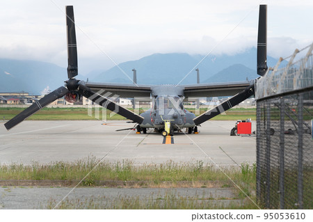 Front view of a US military aircraft V-22 Osprey during maintenance Front view of a US military aircraft V-22 Osprey during maintenance 95053610