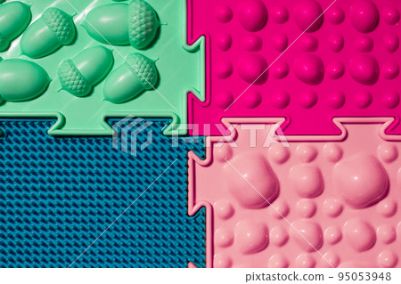 Orthopedic mats view from above. Bright colorful multicolored mats to prevent flat feet and foot massage. 95053948