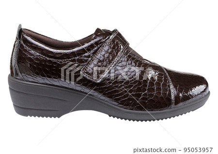 Brown lacquered women's shoes, embossed leather imitating a reptile, on a white background 95053957