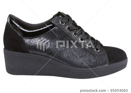 Black autumn women's shoes, with combination skin, an insert imitating a reptile, on a white background Black autumn women's shoes, with combination skin, an insert imitating a reptile, on a white background 95054083