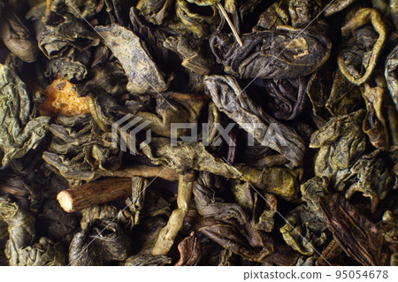 Macro photo of green leaf tea. Chinese tea, oolong, caffeine Macro photo of green leaf tea. Chinese tea, oolong, caffeine 95054678