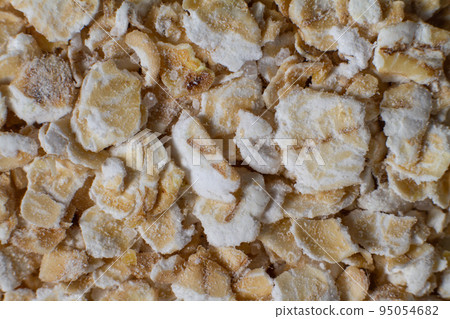 Macro photo of oatmeal. Whole grains of oats, porridge for breakfast. Gluten. 95054682
