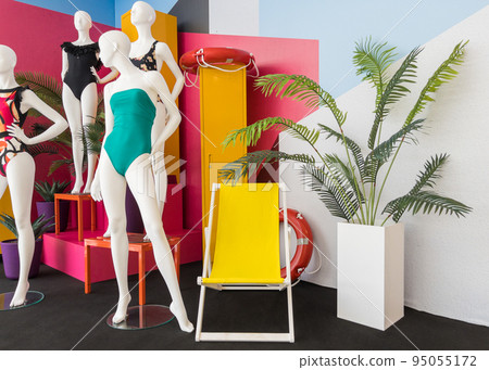 Mannequins in colorful swimsuits in clothes shop. Summer vacation. Fashion model. Colorful vacation concept 95055172