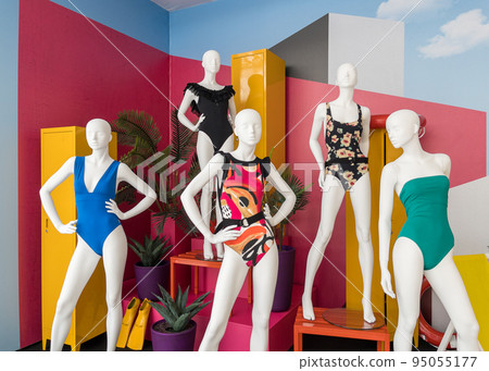Mannequins in colorful swimsuits in clothes shop. Summer vacation. Fashion model. Colorful vacation concept Mannequins in colorful swimsuits in clothes shop. Summer vacation. Fashion model. Colorful vacation concept 95055177