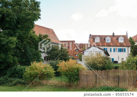 Traditional small house with beautiful outdoor decor facade in Germany. German old brick building house ancient European city German architect 95055574