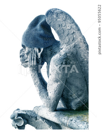 Gargoyle feeling cold isolated on white background, Paris, France 95055622