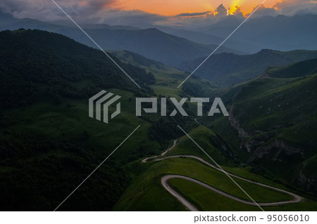 Scenic mountain sunrise landscape in mountains of Caucasus 95056010