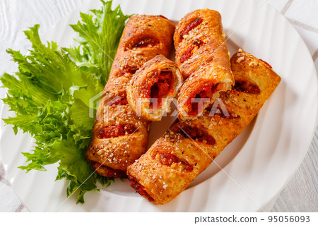 chorizo and semi-dried tomato puff pastry rolls 95056093