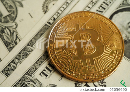 Golden bitcoin on US dollar banknotes money for business and commercial, Digital currency, Virtual cryptocurrency, blockchain technology. Golden bitcoin on US dollar banknotes money for business and commercial, Digital currency, Virtual cryptocurrency, blockchain technology. 95056690