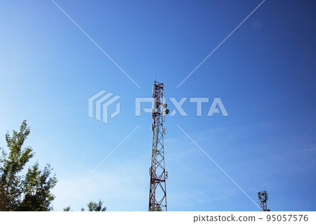 Pole with electric pipelines in a field 95057576