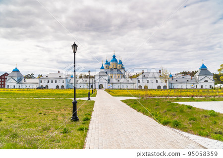 Russia. Leningrad region. May 29, 2022. View of the Nativity of the Theotokos Monastery from the territory of Konevets Island. Russia. Leningrad region. May 29, 2022. View of the Nativity of the Theotokos Monastery from the territory of Konevets Island. 95058359