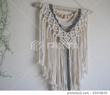 macrame tapestry hanging on the wall 95058630