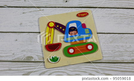 Flat puzzle for kids with excavator. Digger made of wooden parts for assembly by young children 95059018