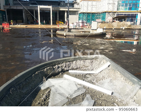 MELAKA, MALAYSIA -JULY 1, 2022: Waterproofing membrane applied by construction workers on top of the concrete slab. Waterproofing layer to prevent water from penetrating below the concrete slab. MELAKA, MALAYSIA -JULY 1, 2022: Waterproofing membrane applied by construction workers on top of the concrete slab. Waterproofing layer to prevent water from penetrating below the concrete slab. 95060663