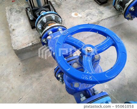 JOHOR, MALAYSIA -AUGUST 1, 2022: Pipe valve is used to control the quantity of water or liquid passing through a pipe. This valve is also used for pipe connections. 95061058