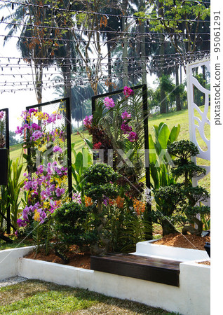 JOHOR, MALAYSIA -MAY 3, 2022: Flower and shrub planter boxes are built in public parks. Exposed to the weather and only hardy plants are planted here. JOHOR, MALAYSIA -MAY 3, 2022: Flower and shrub planter boxes are built in public parks. Exposed to the weather and only hardy plants are planted here. 95061291