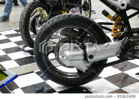JOHOR, MALAYSIA -APRIL 4, 2022: Disc-type motorcycle rear brake. This brake can provide more grip than a drum brake. Usually used in modern high-powered motorcycles. 95061606