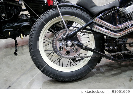 JOHOR, MALAYSIA -APRIL 4, 2022: Disc-type motorcycle rear brake. This brake can provide more grip than a drum brake. Usually used in modern high-powered motorcycles. 95061609