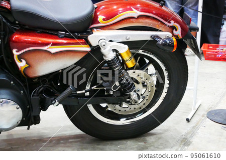 JOHOR, MALAYSIA -APRIL 4, 2022: Disc-type motorcycle rear brake. This brake can provide more grip than a drum brake. Usually used in modern high-powered motorcycles. 95061610