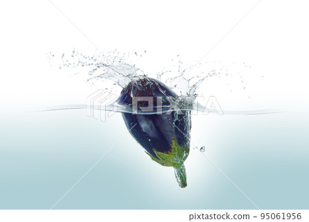 Aubergine splashing in water. Aubergine splashing in water. 95061956