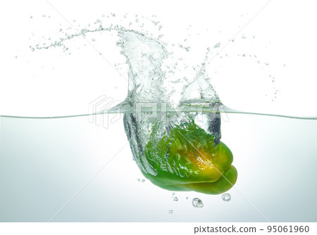Green pepper splashing in water. Green pepper splashing in water. 95061960