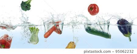 Many different vegetables splashing in water. Many different vegetables splashing in water. 95062232