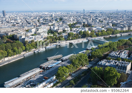 Panoramic view from second floor of Eiffel tower in Paris. View of the buildings, parks with Debilly foot bridge over river Siene Panoramic view from second floor of Eiffel tower in Paris. View of the buildings, parks with Debilly foot bridge over river Siene 95062264