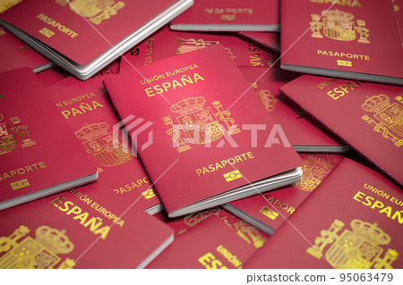Heap of Spain passports. Immigration, citizenship, travel and tourism concept. 95063479