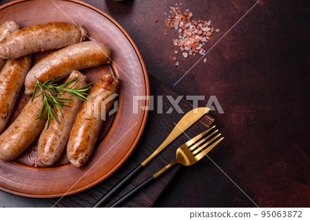 Roasted sausages grill with spices and herbs with salt and pepper Roasted sausages grill with spices and herbs with salt and pepper 95063872