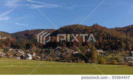 autumn village landscape hills covered by forest 95064407