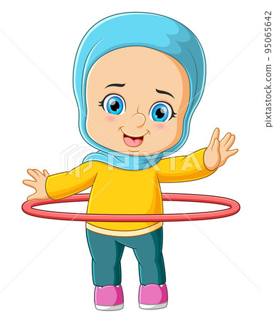 The young girl is practicing with the hula hoop The young girl is practicing with the hula hoop 95065642