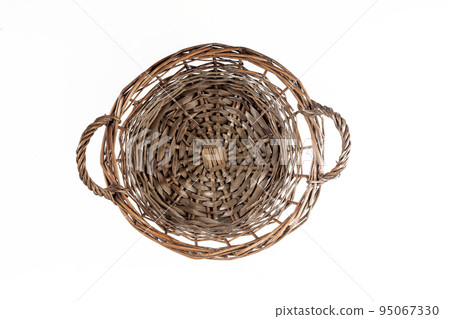 Top view of a wicker basket with handles, isolated Top view of a wicker basket with handles, isolated 95067330