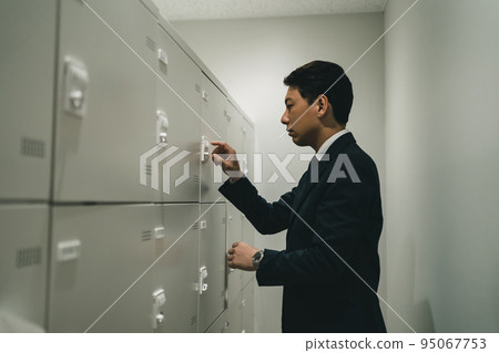 Office workers in lockers and suits Office workers in lockers and suits 95067753